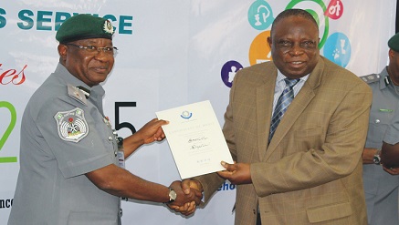 L-r: Dikko inde Abdullahi, comptroller-general of the Nigerian Customs Services presents the award to  Oluropo Owolabi, managing director \CEO, SAHCOL